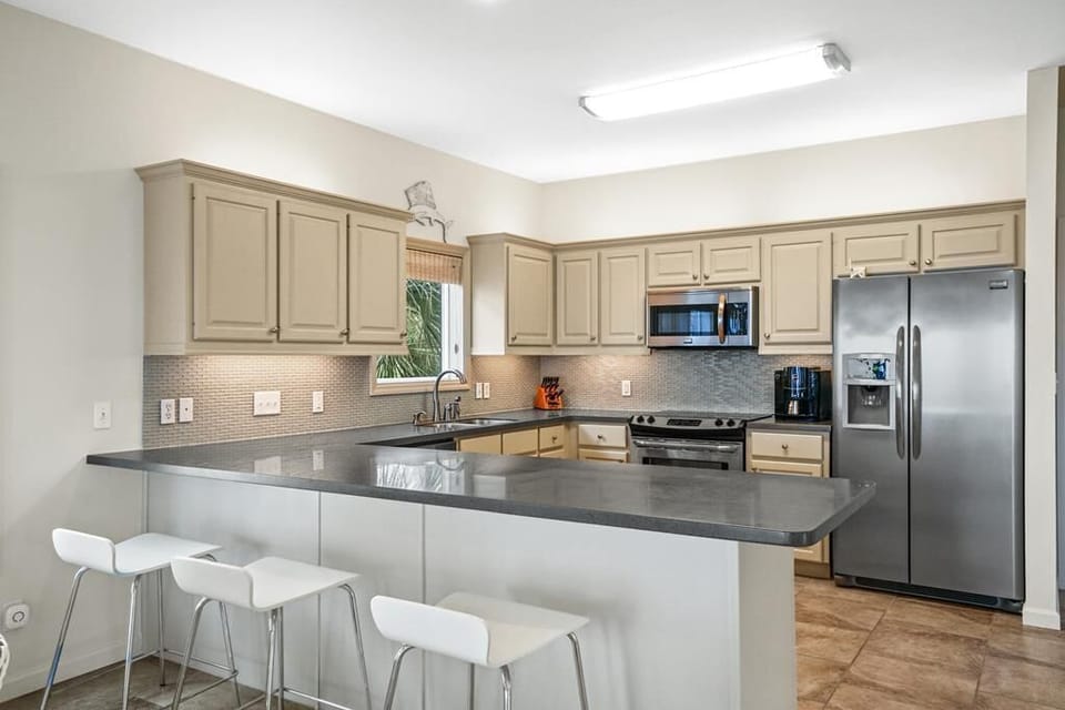 The Sunlounger well stocked kitchen with corian countertop