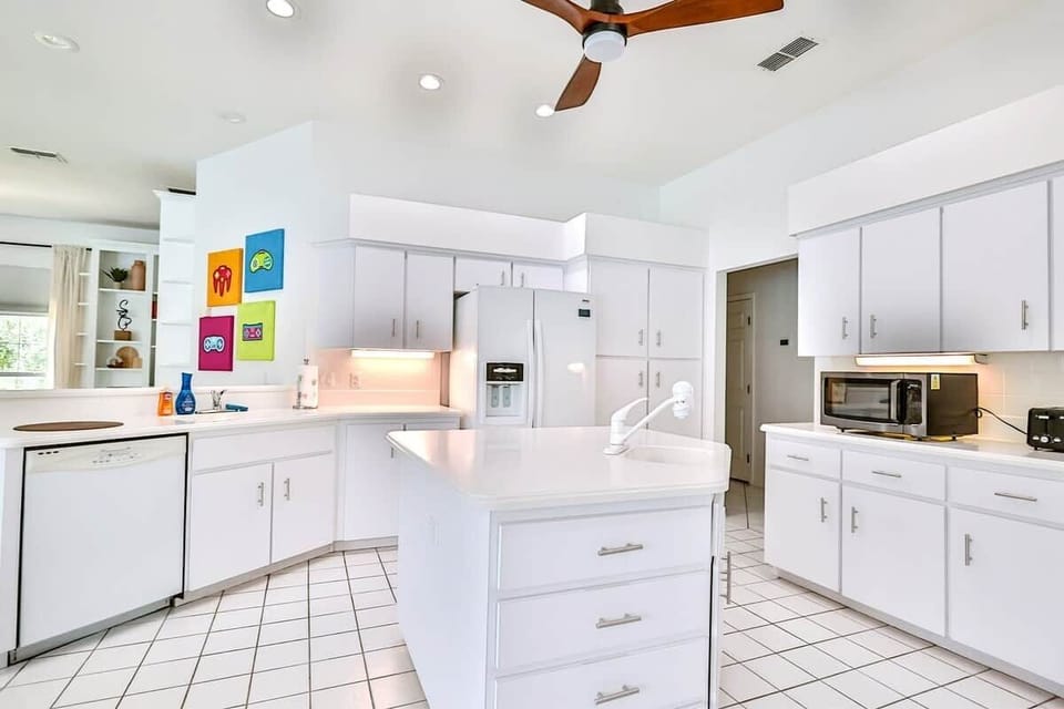 Bright, fully equipped kitchen with modern appliances, ample counter space, and everything you need to prepare meals at home.