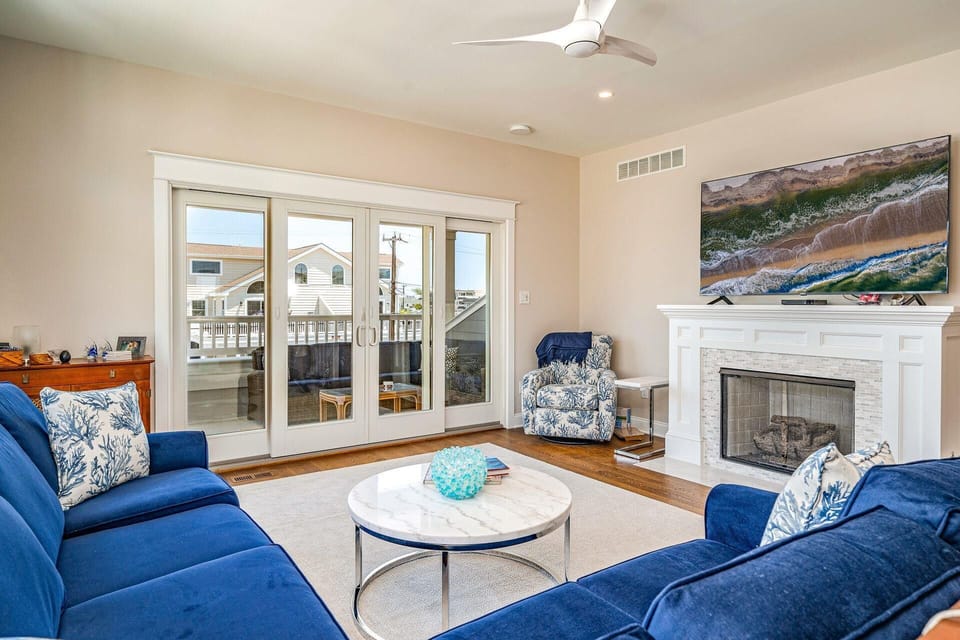 Living room, large sectional, fireplace and relaxing deck