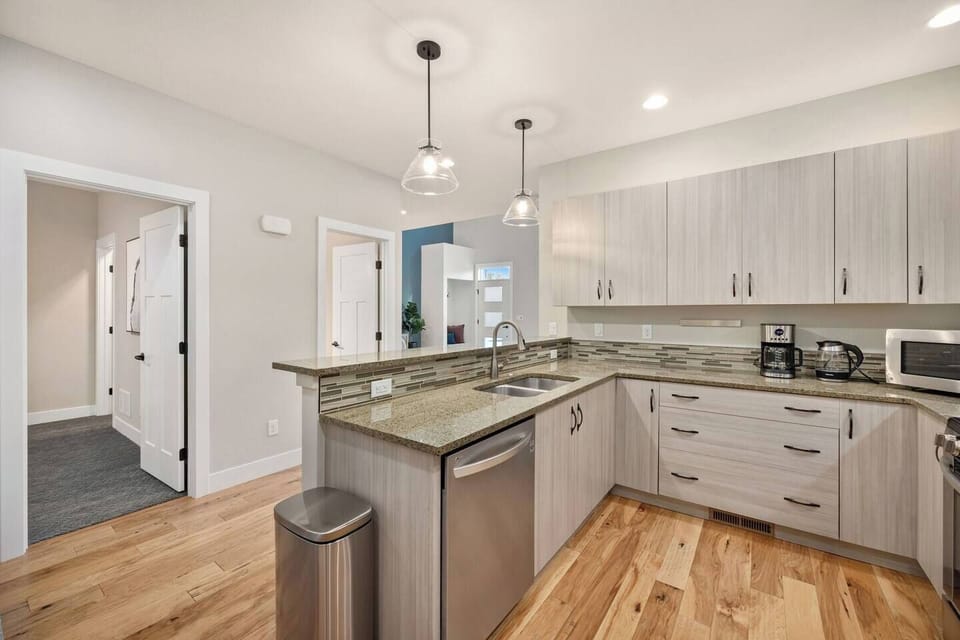Kitchen view showing entry to main floor primary bedroom
