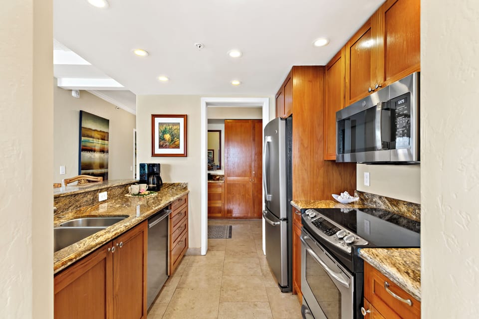 Cook with ease in a thoughtfully designed, fully equipped kitchen. Featuring modern appliances, ample counter space, and all the essentials you need, from quick island breakfasts to full home-cooked dinners.