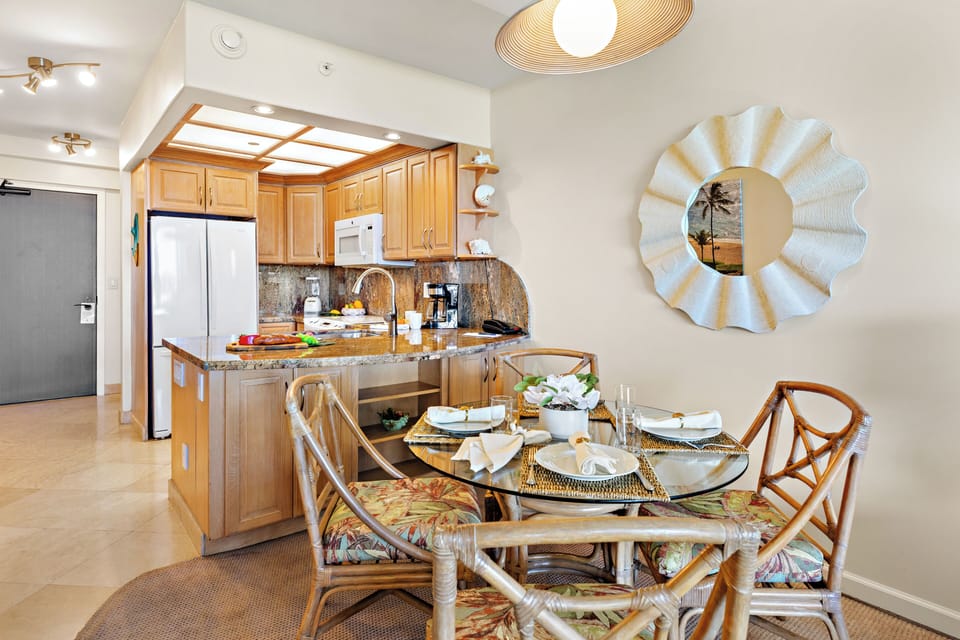 Gather, dine, and create lasting memories in the charming dining area, conveniently connected to the fully equipped kitchen and living space.