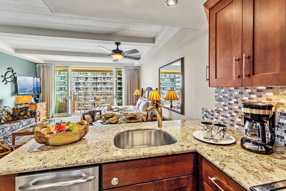 Thoughtfully designed for relaxed resort living, this bright and modern kitchen features sleek quartz countertops, stainless steel appliances, and a clean coastal aesthetic—perfect for preparing your favorite island inspired meals.