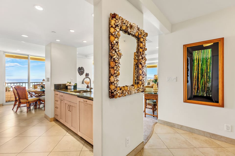 Welcoming entryway featuring elegant coastal décor, refined finishes, and an open flow that sets the tone for a relaxing and upscale island retreat.