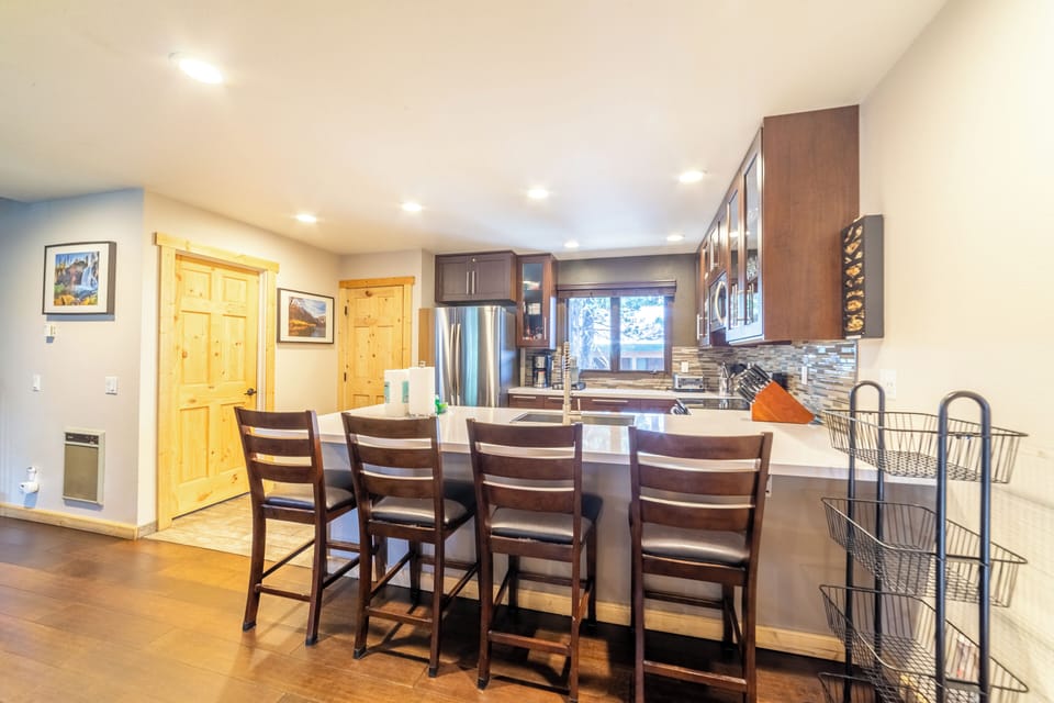 Fully Stocked Kitchen with Bar Seating