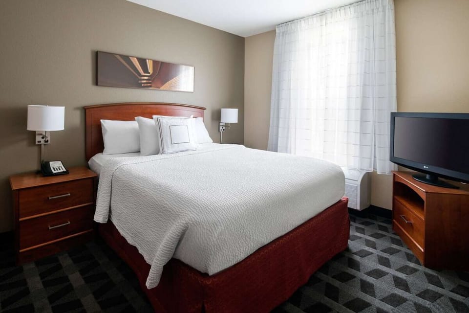 Sink into crisp bedding for a restful night’s sleep.