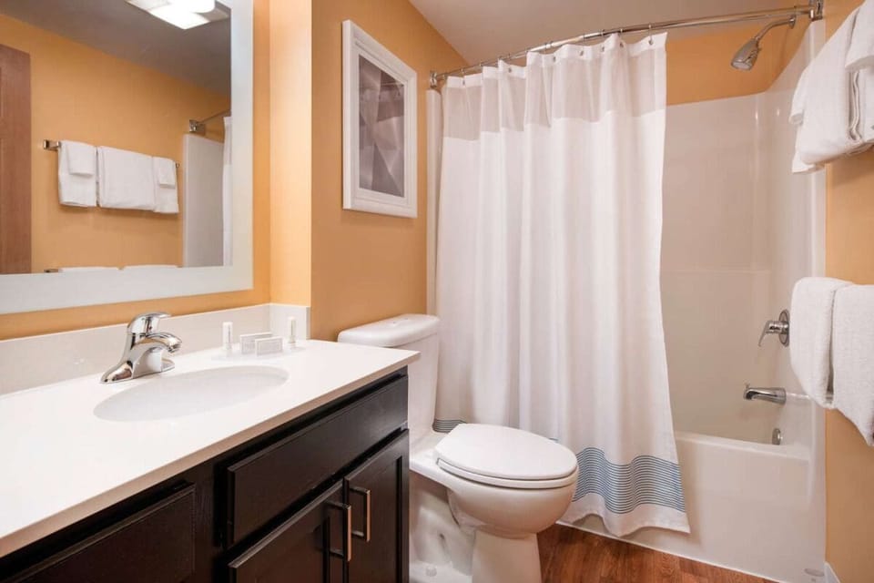 Refresh with a bright vanity and clean, fluffy towels.