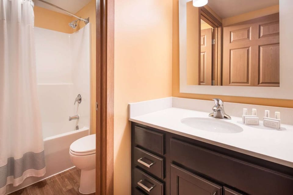 Rinse off in a spotless shower-tub after busy days.