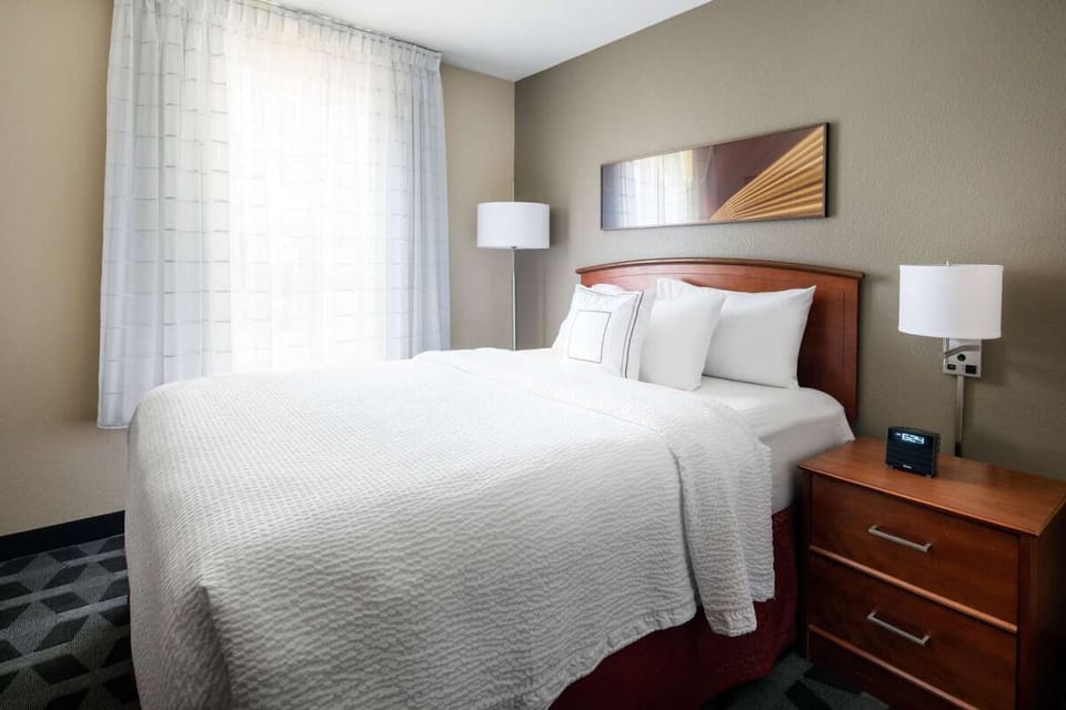 Wake to soft daylight streaming through sheer, airy curtains.