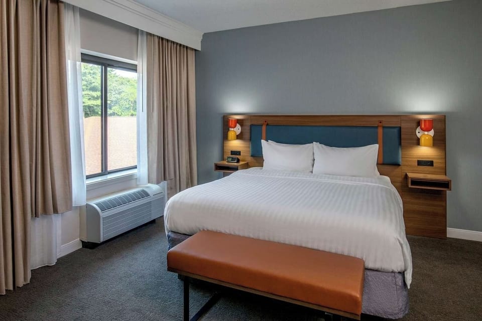 Sink into crisp linens and enjoy a serene, restful sleep.