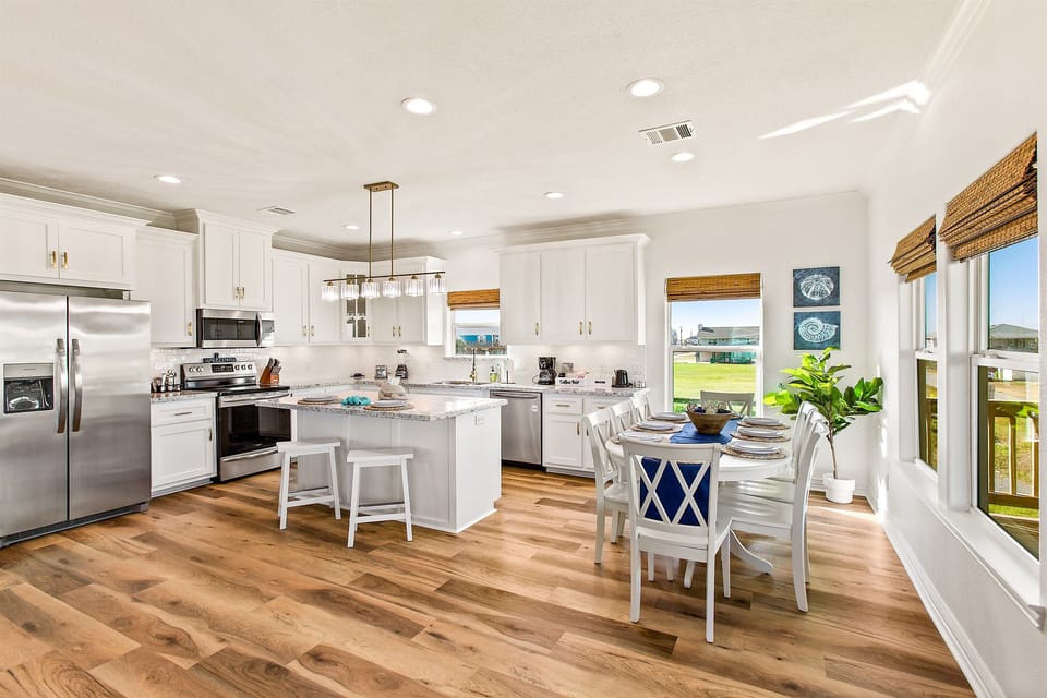 Kitchen area with total seating for 10. Additional seating on the outdoor covered table, or sectional indoors.