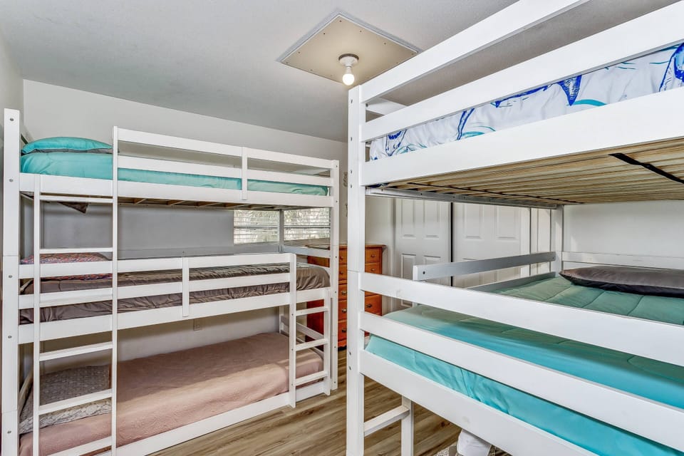 Bunk room with 2 sets of triple bunk beds