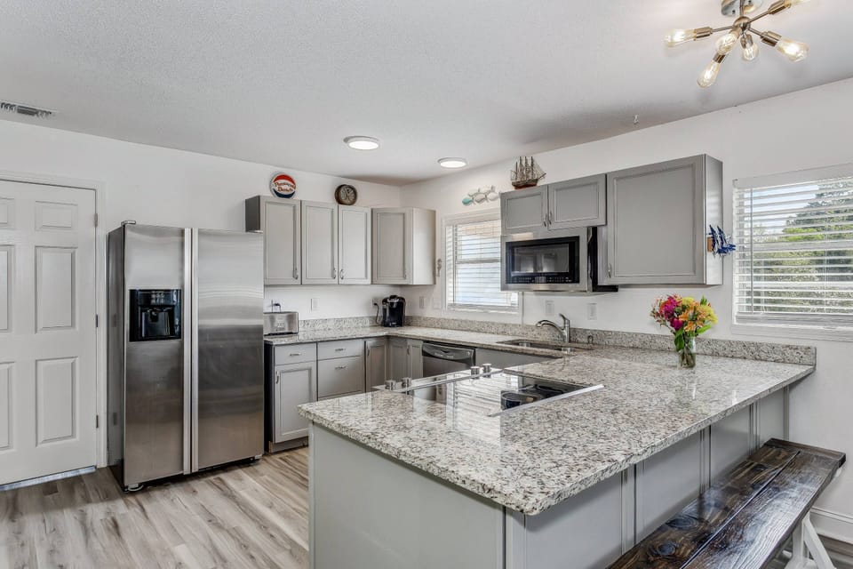 The kitchen has been completely updated with granite counters and high end stainless steel appliances