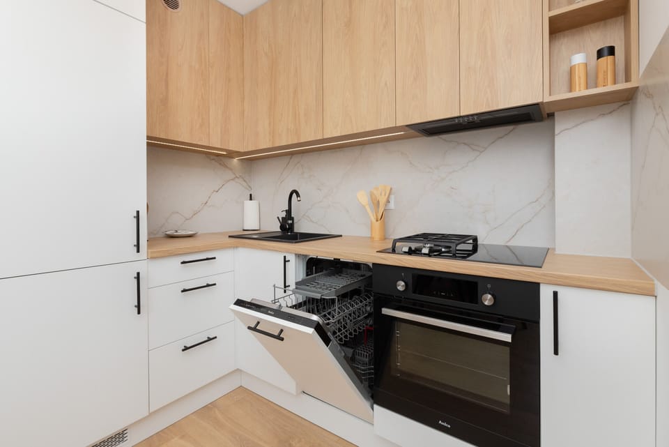 The kitchen offers a functional layout for convenient cooking. 
