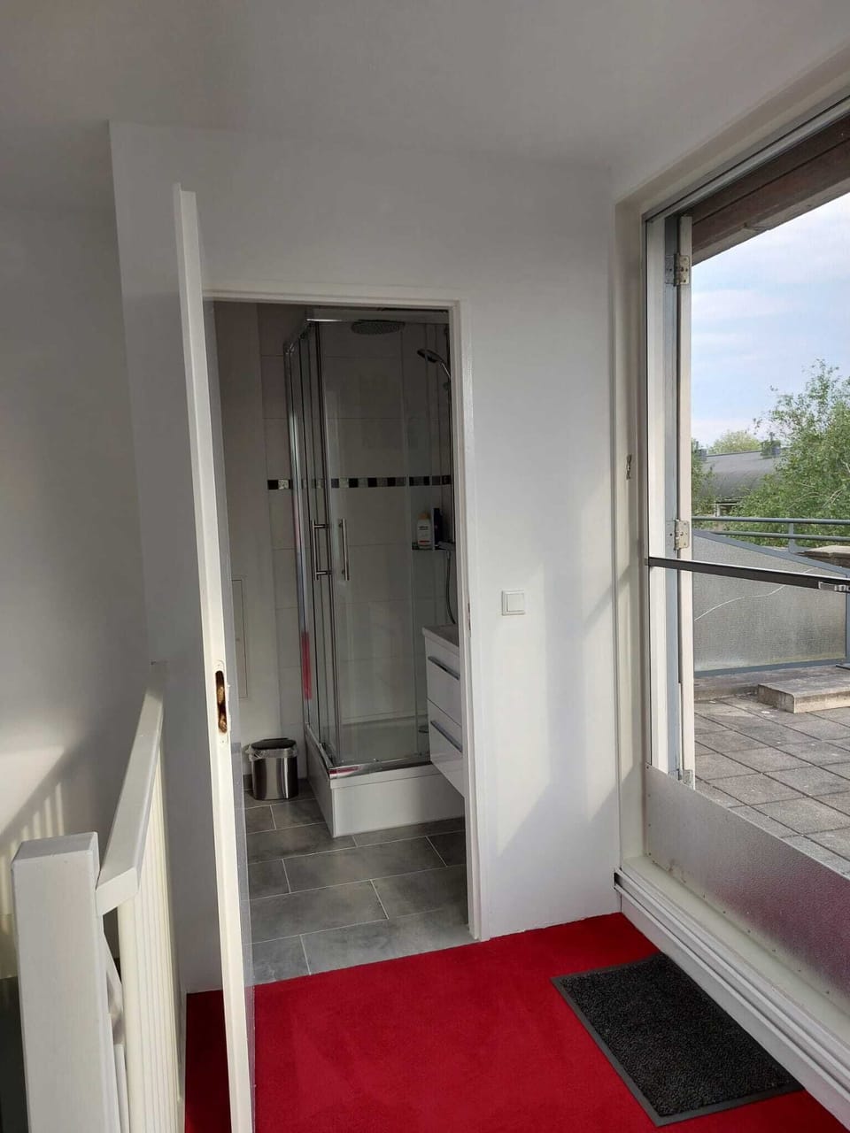 Upstairs hallway to bathroom and terrace