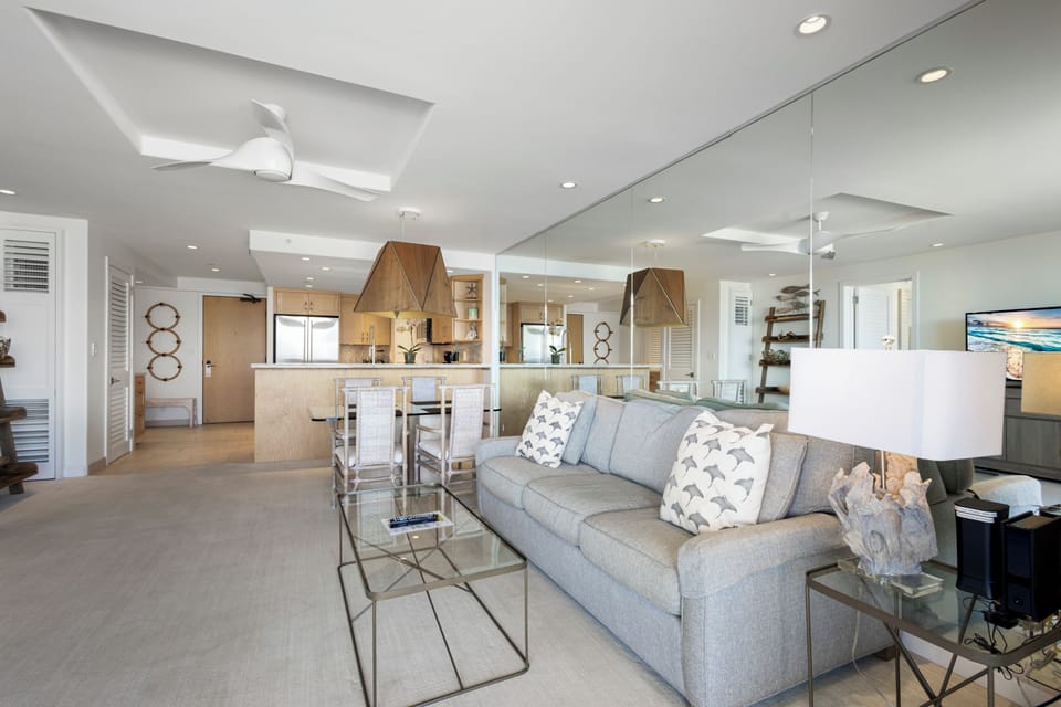 Unwind in your open-concept living space, where bright coastal style meets modern comfort. Relax on the plush sofa, enjoy meals at the dining table, and feel at home in this thoughtfully designed retreat.