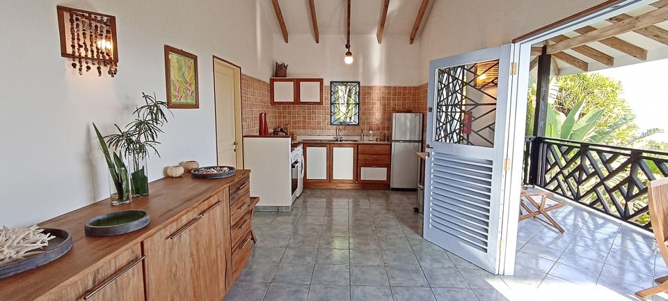 Open plan living and fully equipped kitchen leading directly onto the veranda.