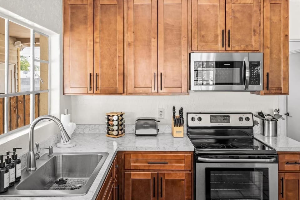 We provide several amenities for an easy stay, including dish soap, hand soap, lotion, spices, enough paper towels to get you started, knives and kitchen utensils. We also provide salt and pepper and olive oil (in cupboard, not pictured).
