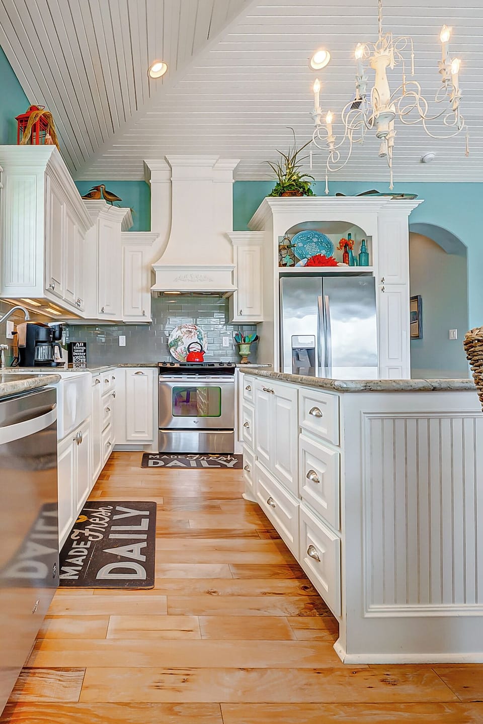 Fully stocked kitchen with refrigerator, microwave and oven