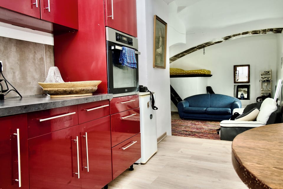 Fully equipped kitchen with crockery and utensils.