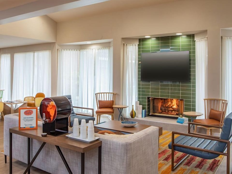 Warm up by the fireplace in a calm, sunlit lounge.
