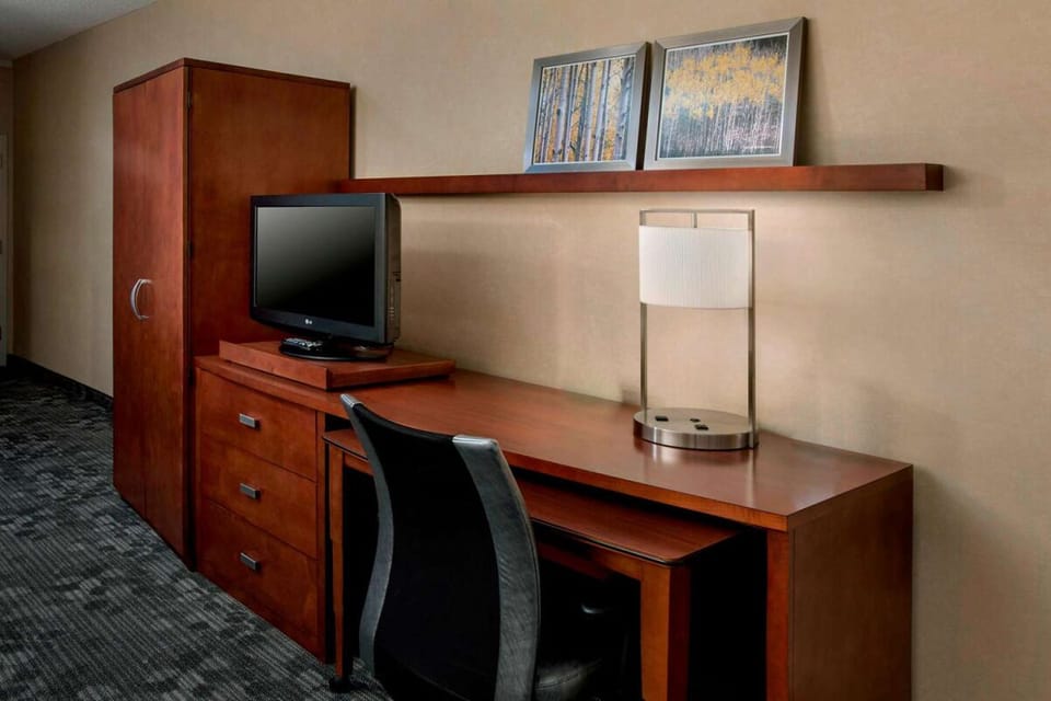 Catch up on emails at a dedicated desk with ample storage.