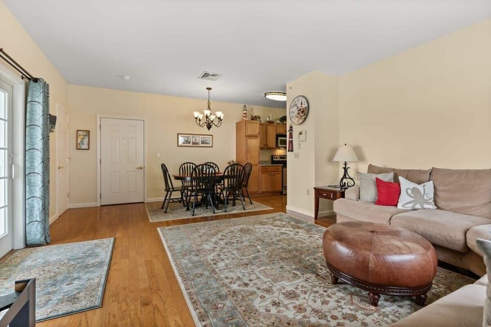 Open living room with gas fireplace and slider onto your private deck. Cozy up and relax.