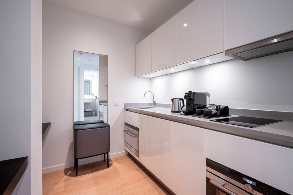 Prepare easy meals with sleek counters and modern appliances.