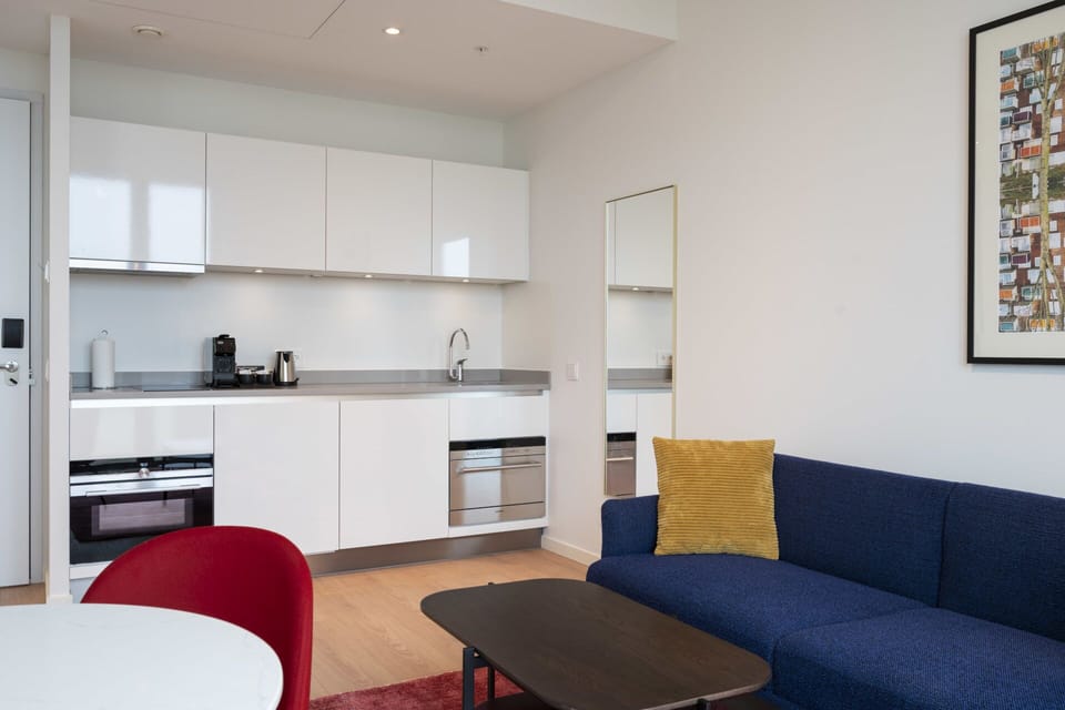 Settle in with a bright kitchenette and cozy lounge corner.