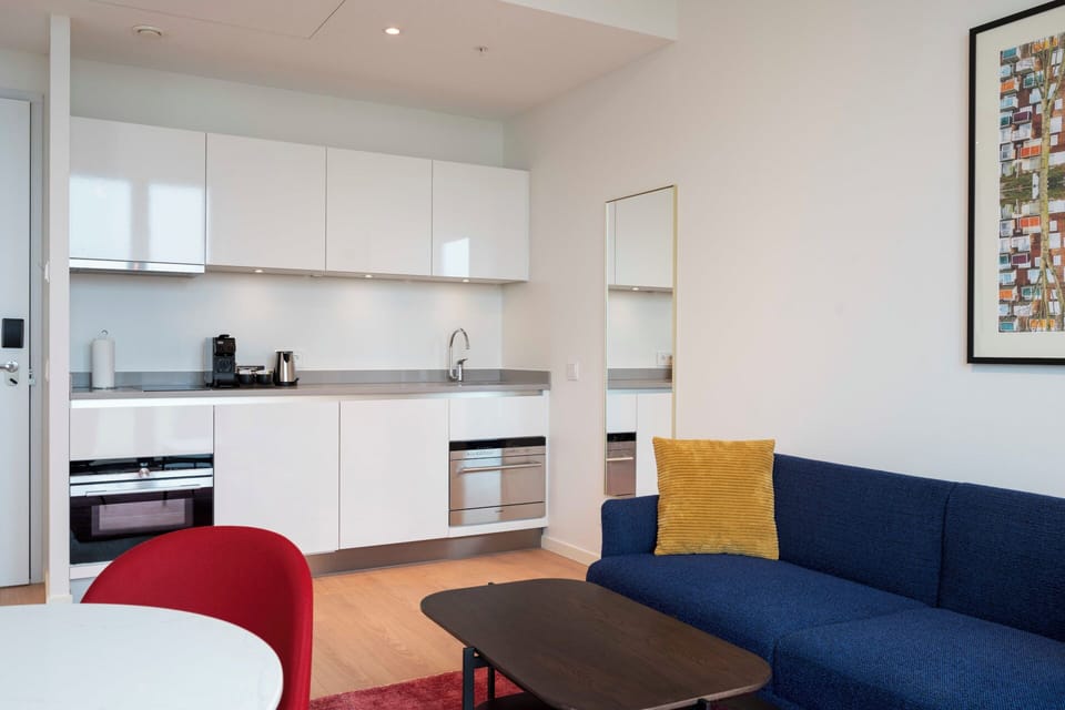 Settle in with a bright kitchenette and cozy lounge corner.