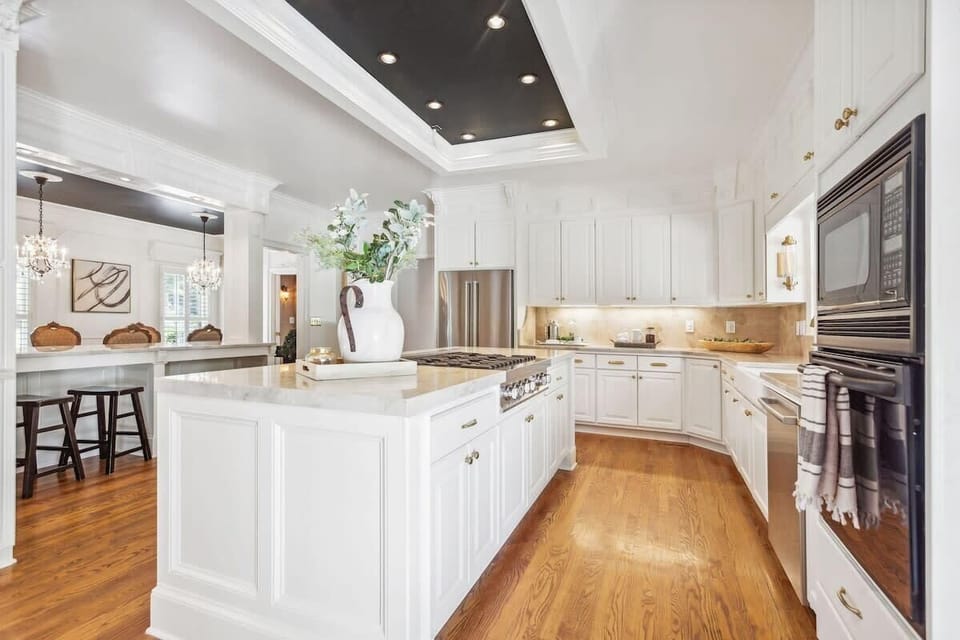 Professional Chef's kitchen overlooking back yard and deck area.