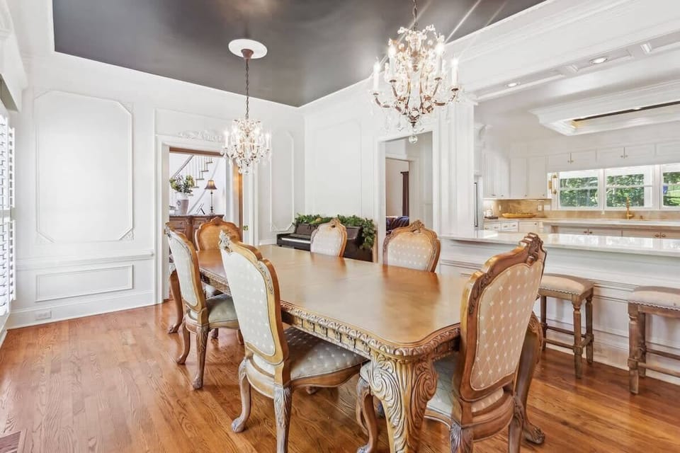Lots of light in this formal dining room area.