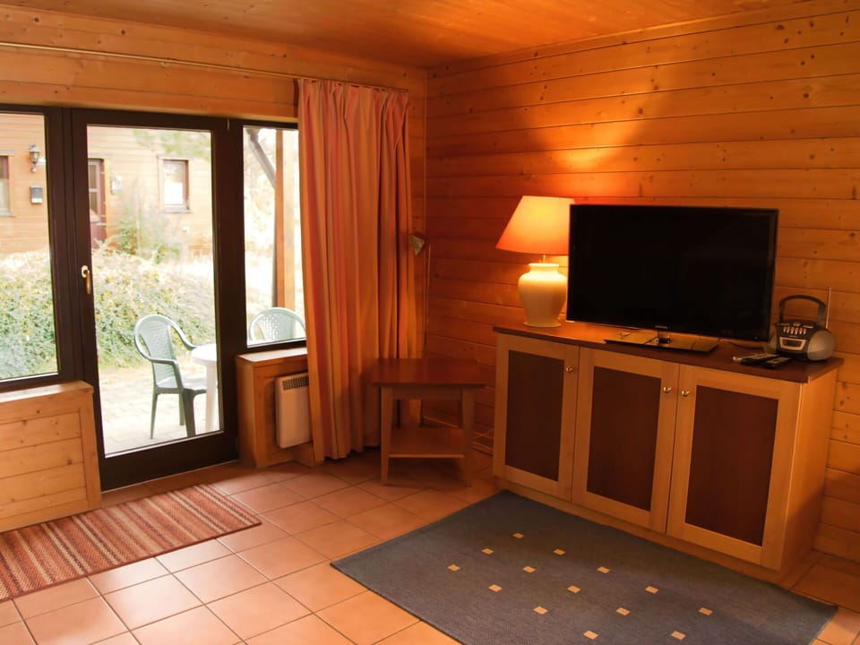 Property, Television, Building, Wood, Plant, Interior Design, Table, Floor, Comfort, Flooring