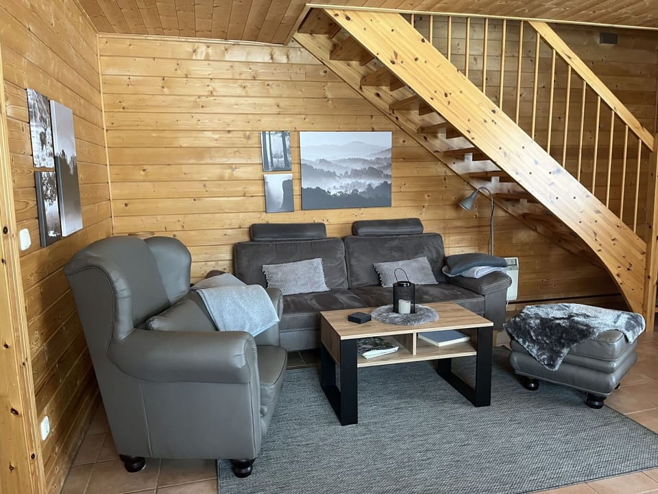 Property, Couch, Wood, Interior Design, Building, Flooring, Floor, Living Room, Comfort, Hardwood