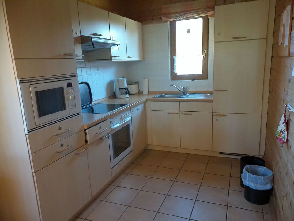 Cabinetry, Kitchen Sink, Countertop, Property, Tap, Sink, Kitchen Appliance, Window, Kitchen Stove, Kitchen