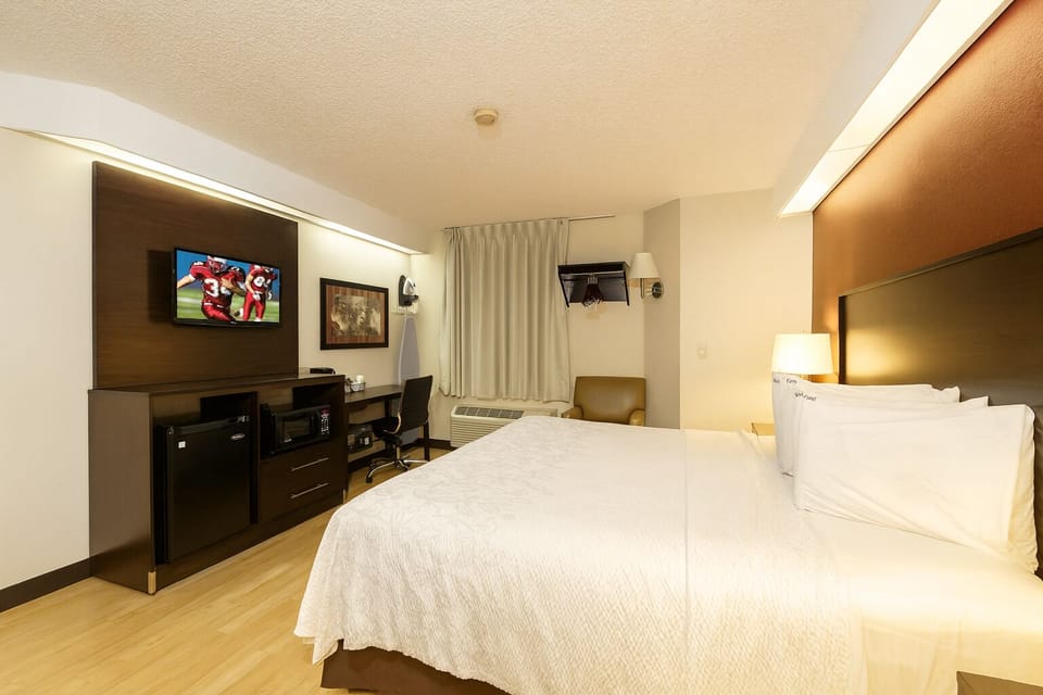 Kick back with in-room entertainment and a handy work desk.