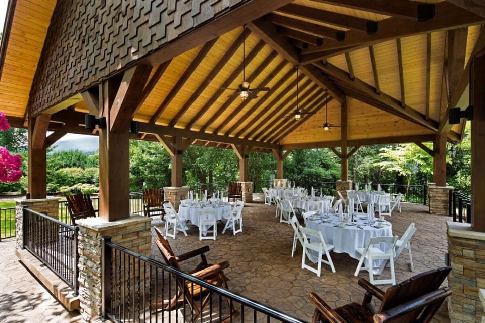 Host relaxed outdoor moments under a warm, timber pavilion.