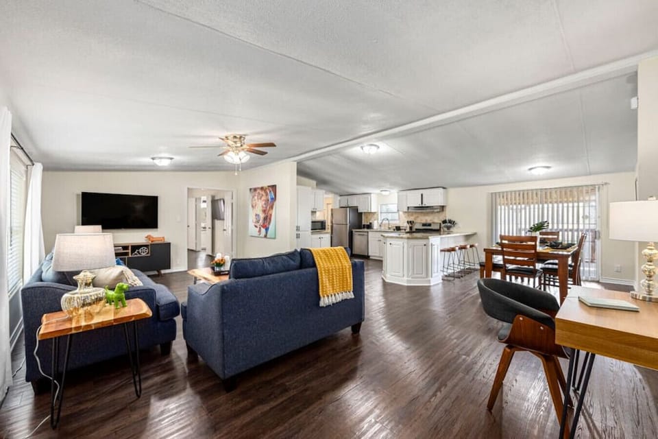 Open-concept layout connecting the living room, kitchen, and dining area
