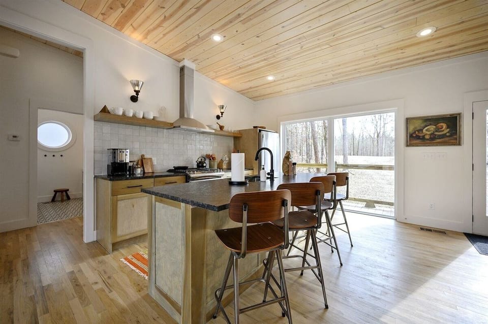 Kitchen: Chef's paradise with sleek counters, modern appliances, and natural light pouring in!