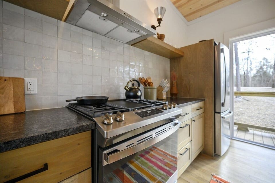 Gourmet Kitchen: Cook up a feast with modern appliances and bright, inviting views of nature!