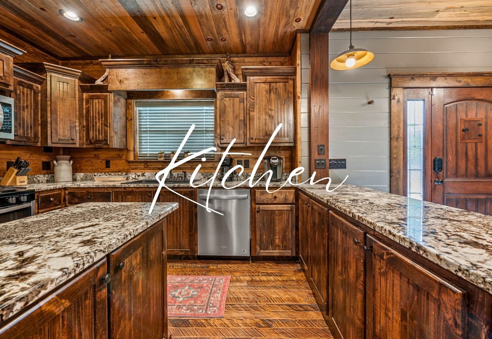 Kitchen area with wood cabinetry and granite countertops