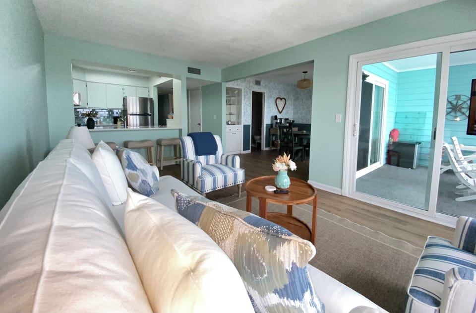 Open concept view from the living room into the kitchen & dining rooms.