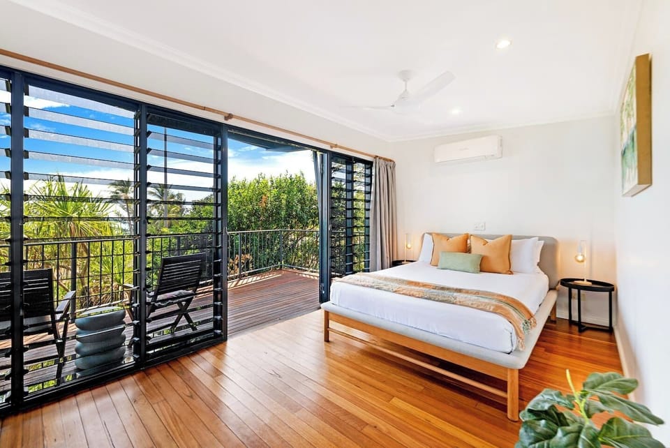 The primary bedroom comes with a sumptuous queen-sized bed, its own TV and direct access to the balcony.