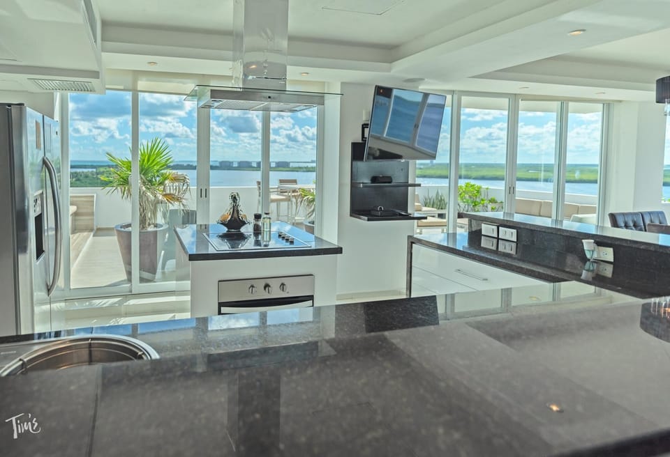 Kitchen while Sitting at the Breakfast Bar - The Kitchen has a reverse osmosis system which provides plenty of clean drinking water