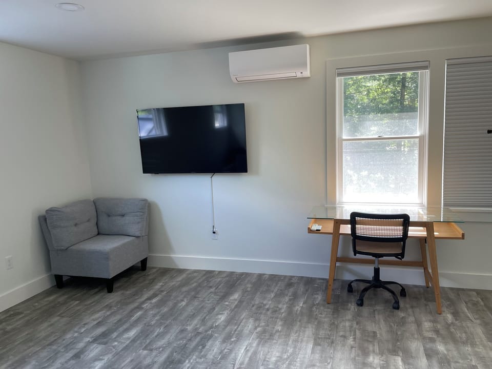 Primary bedroom with dedicated work area