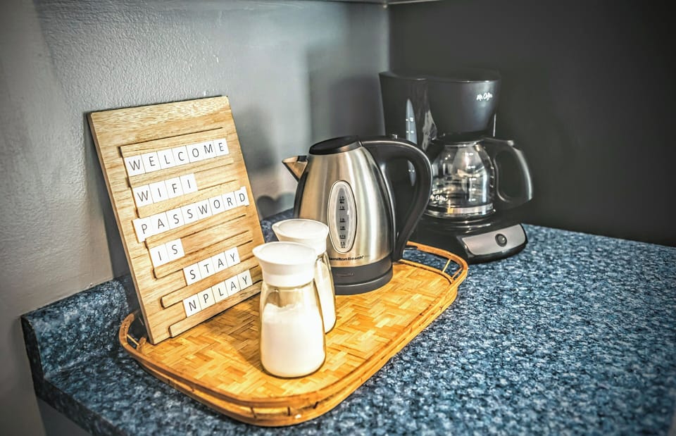 drip style coffee maker with coffee supplied and hot water kettle