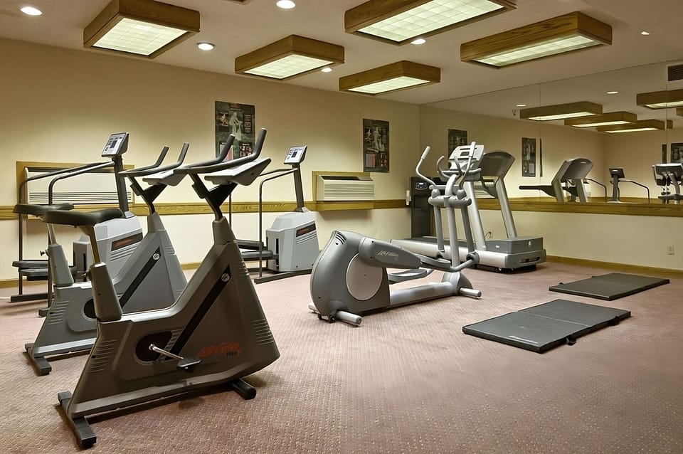 Keep momentum going with ellipticals and open stretching space.