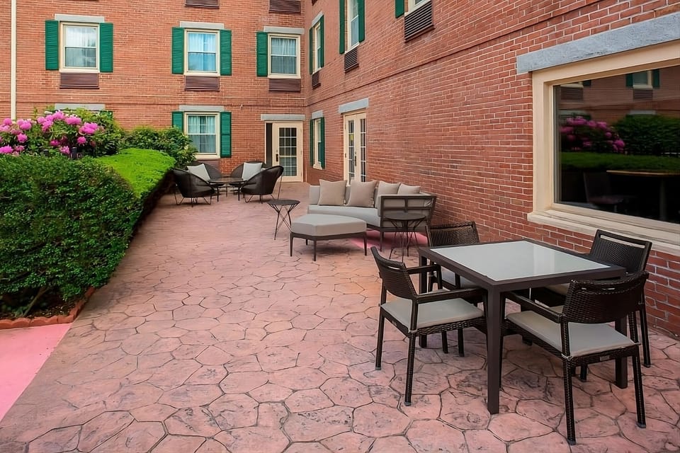 Sip coffee outdoors in the peaceful courtyard seating area.