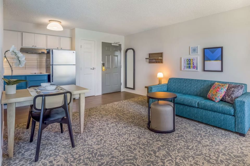 Kick back on the sofa in a calm, open-concept suite