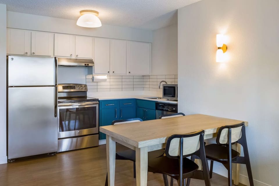 Cook easy meals with full-size appliances and roomy dining table